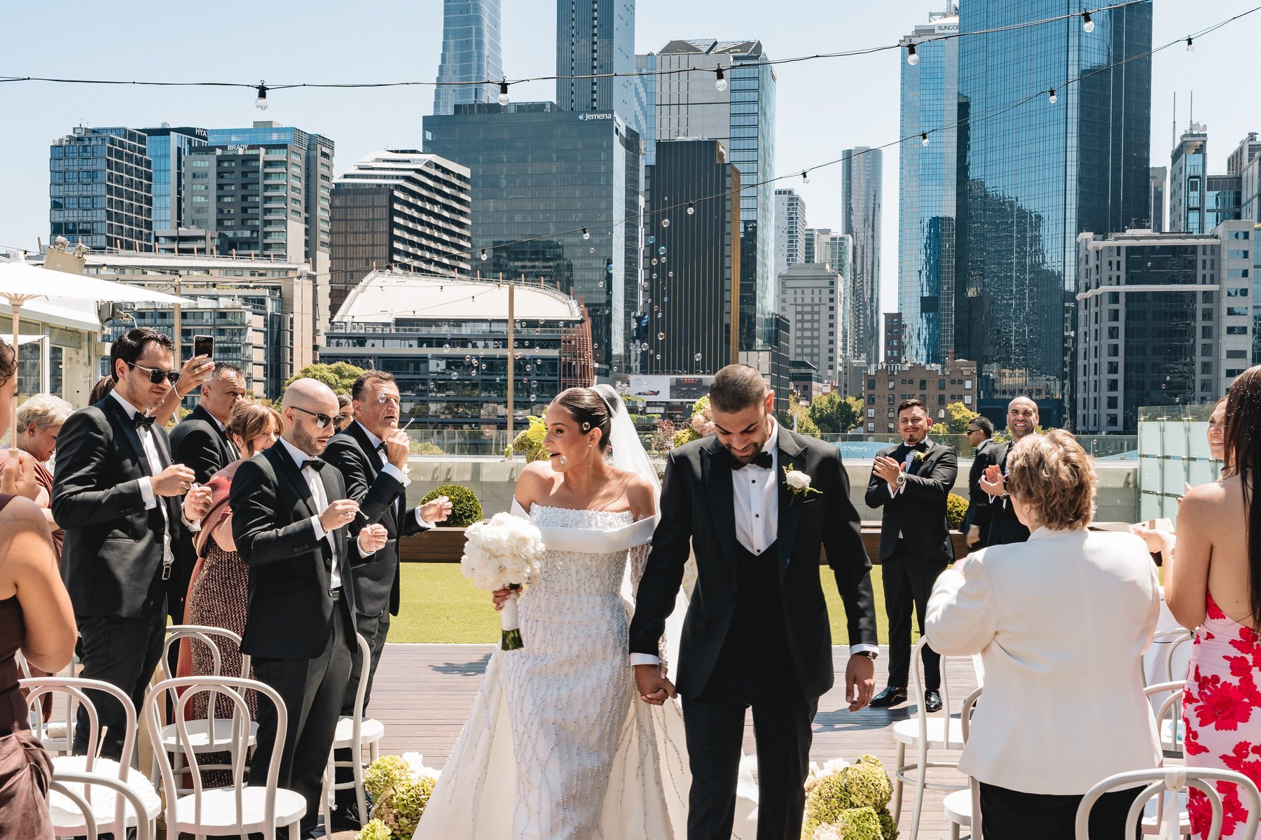 Crown Melbourne wedding — rooftop ceremony at Crown Aviary above the Southbank skyline, by C2 Films