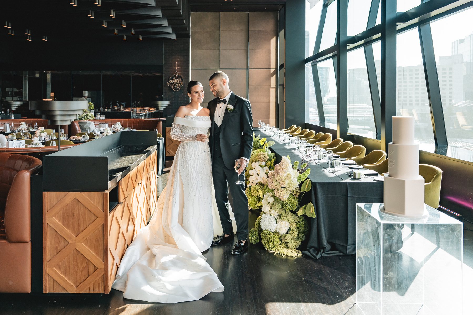 Crown Melbourne wedding — Crown Evergreen reception with Melbourne skyline through the glass, by C2 Films