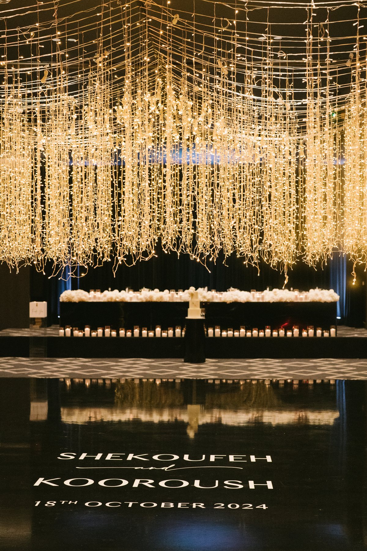 Lakeside Receptions wedding — cascading light installation above the bridal table, by C2 Films