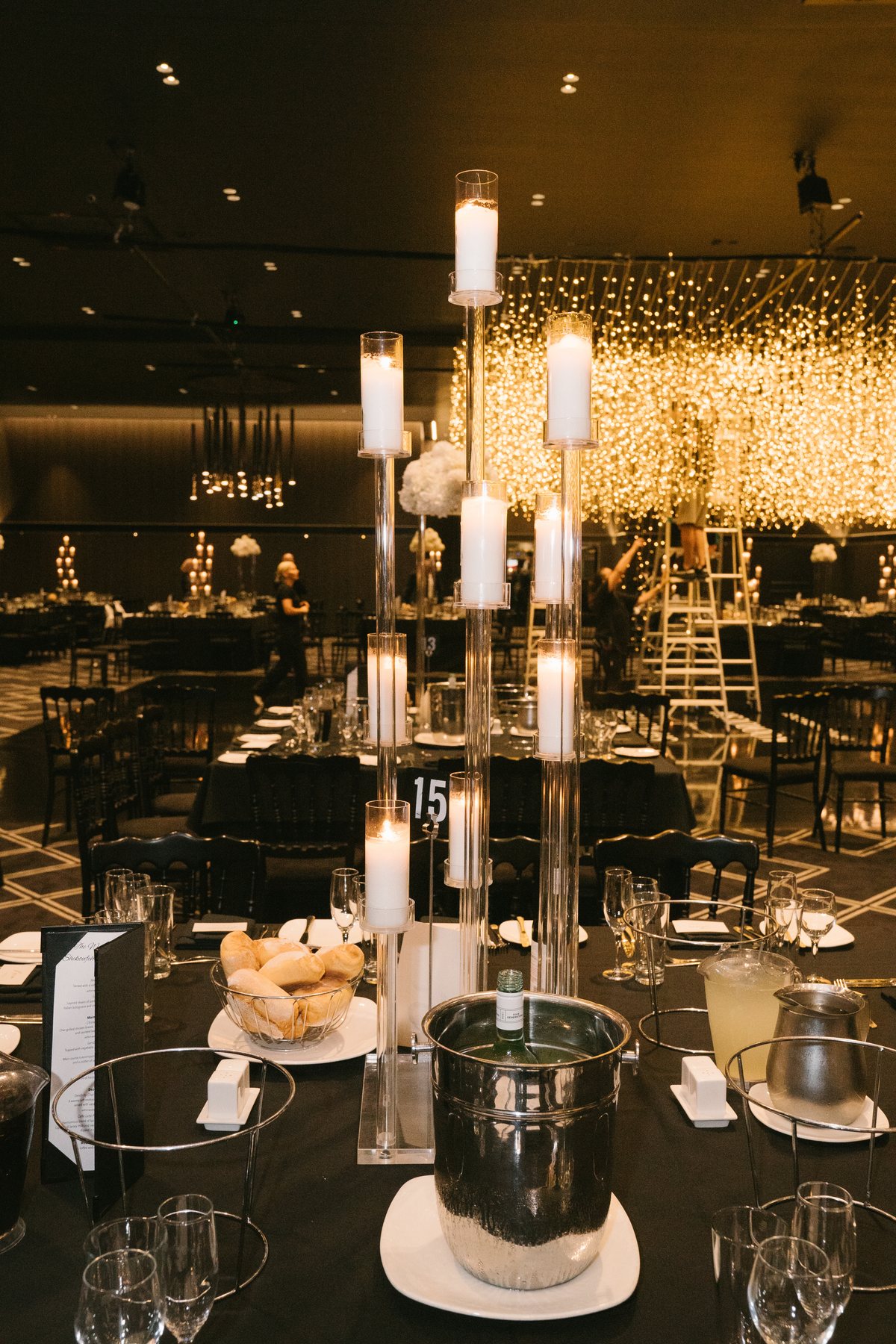 Lakeside Receptions wedding — reception table styling with candlelight, by C2 Films