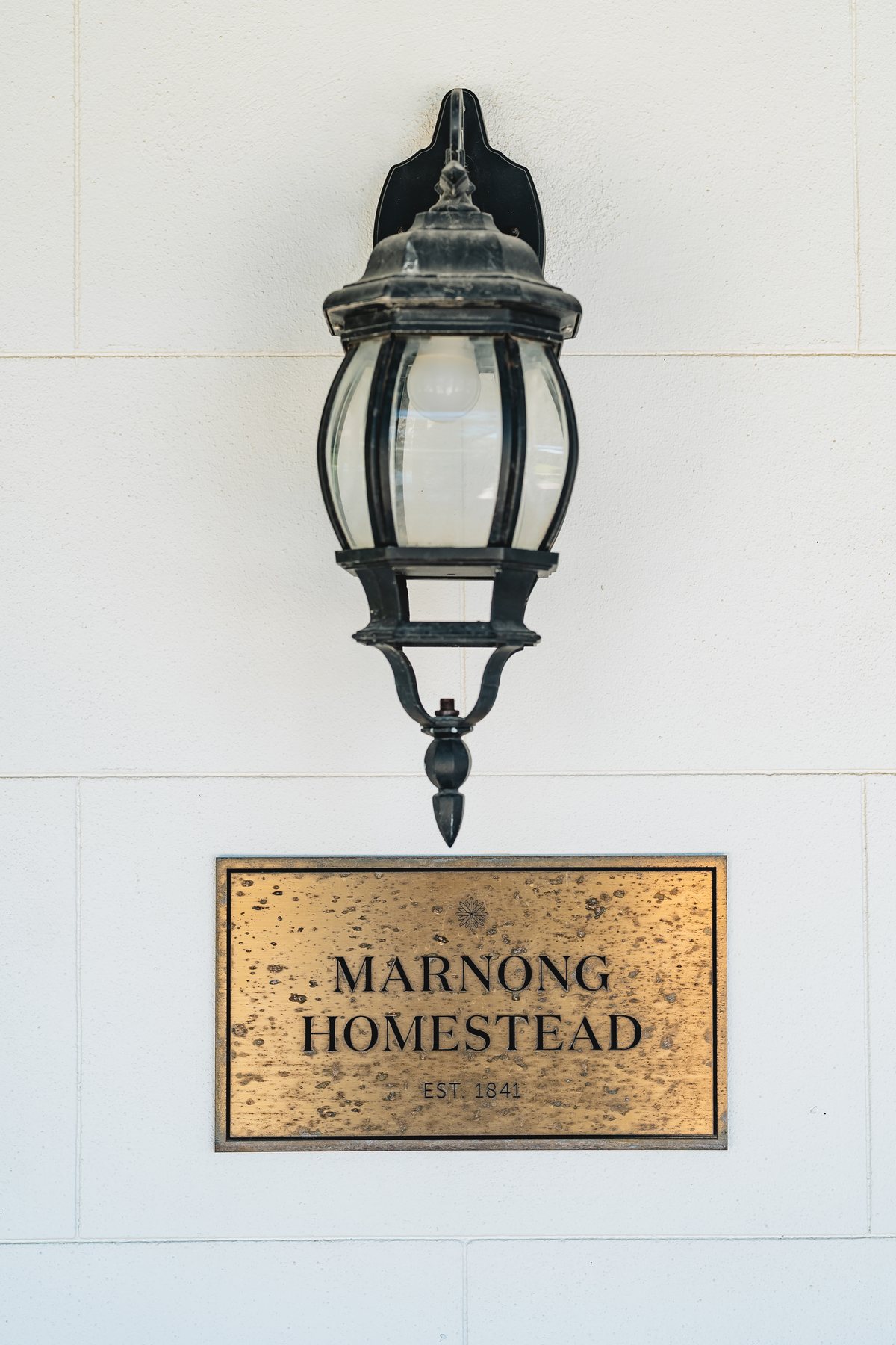 Marnong Estate wedding — the Marnong Homestead plaque, established 1842, by C2 Films