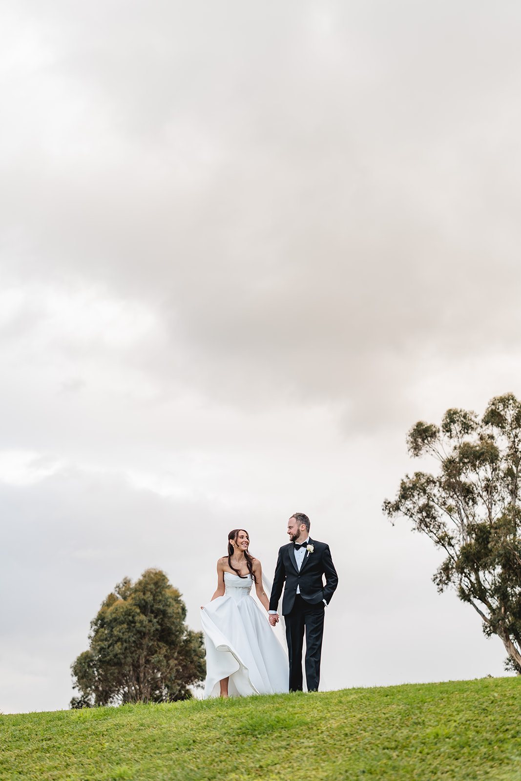 Marnong Estate wedding — couple on the hilltop beneath open sky, photographed by C2 Films