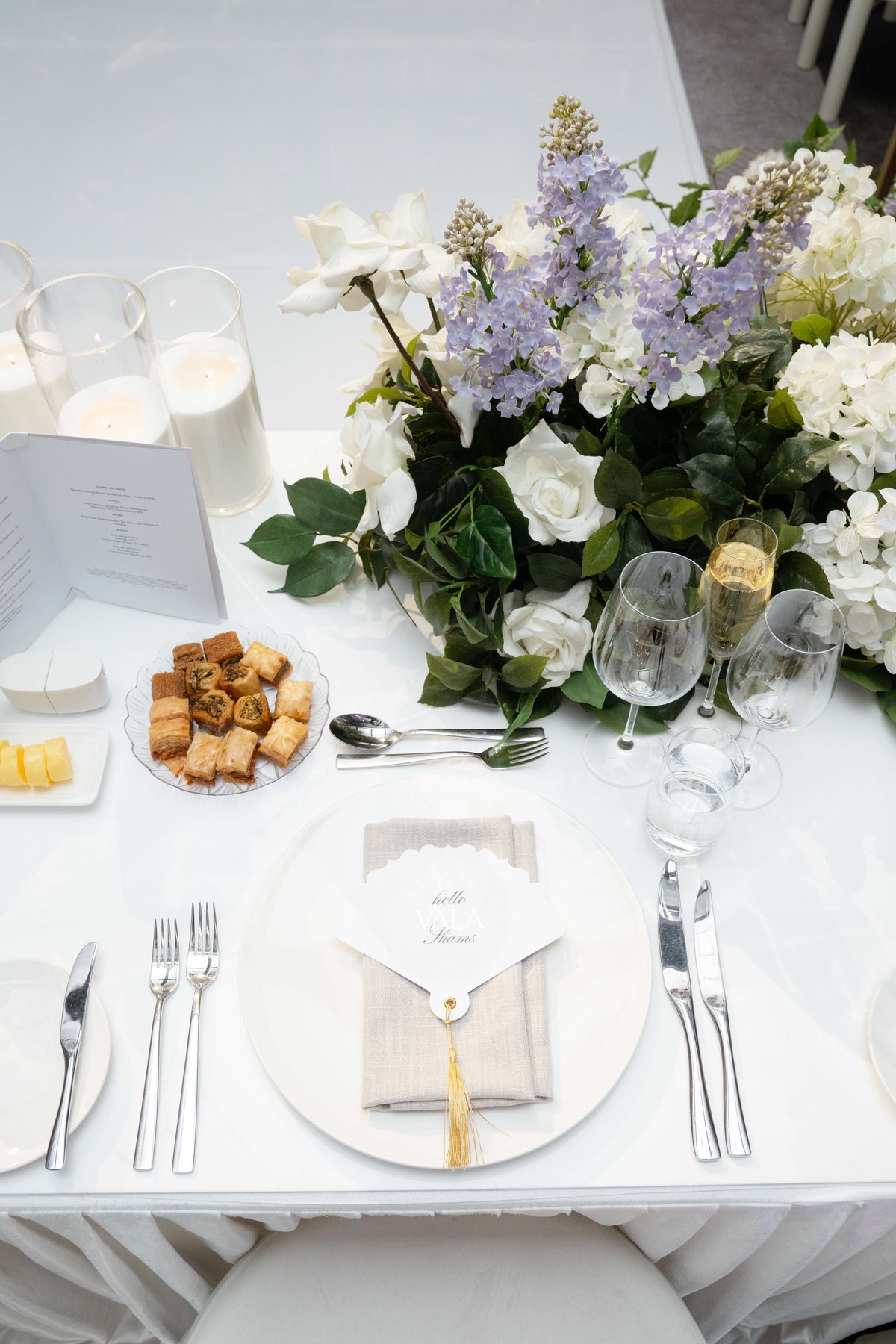Ritz-Carlton Melbourne wedding — place setting and floral styling detail, by C2 Films