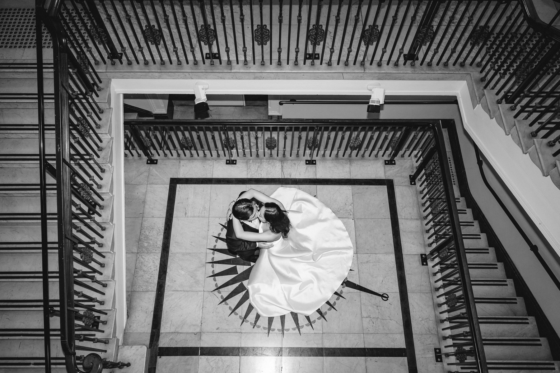 State Library Victoria wedding — black and white frame down the library staircase, by C2 Films