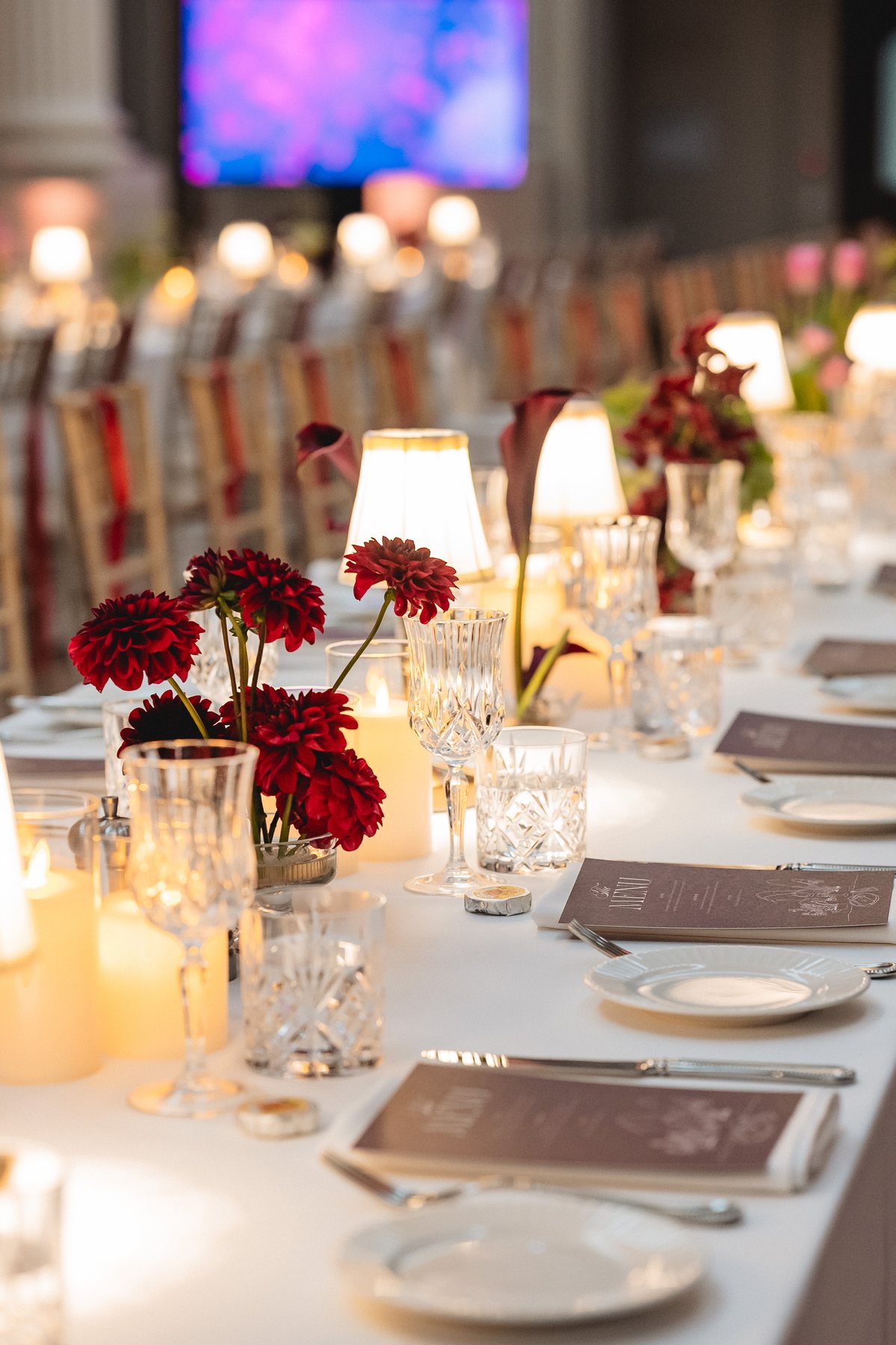 State Library Victoria wedding — reception table styling with dahlias and candlelight, by C2 Films