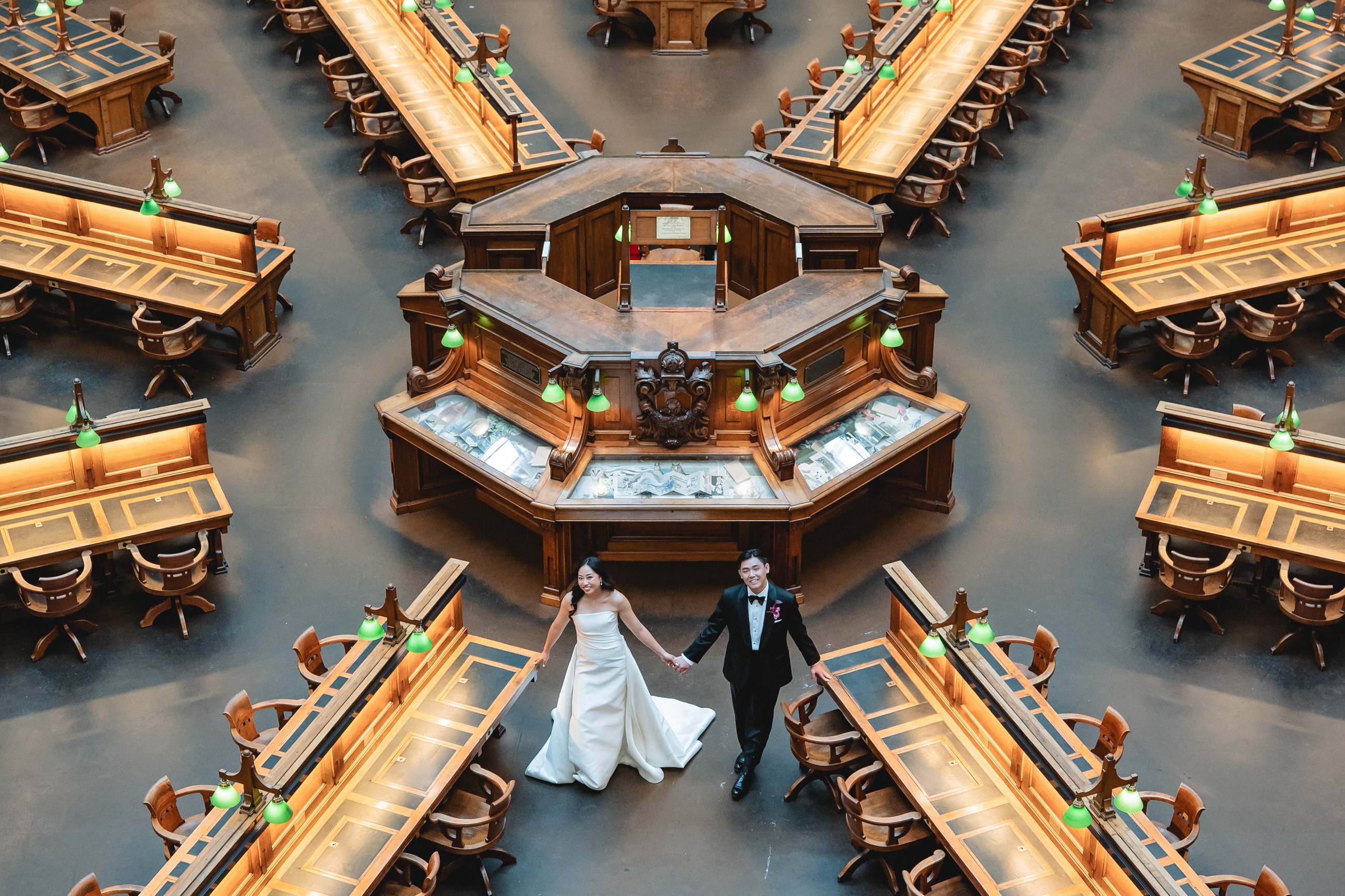 State Library Victoria wedding — bride and groom beneath the La Trobe Reading Room dome, photographed by C2 Films