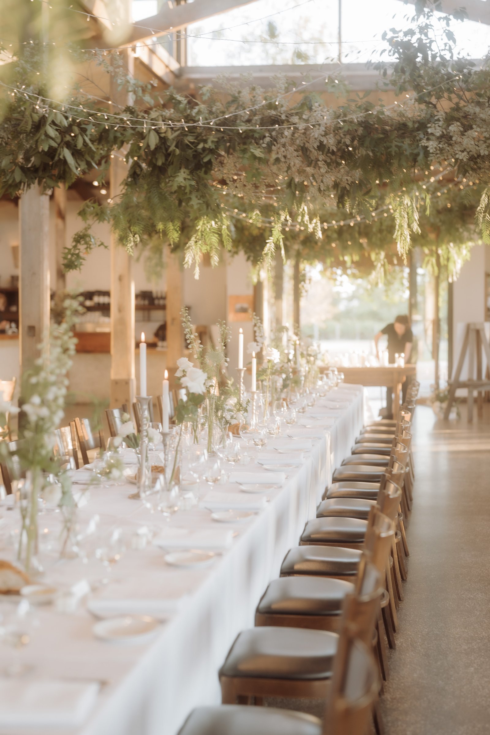 Stones of the Yarra Valley, Coldstream wedding — reception room set for a wedding, photographed by C2 Films