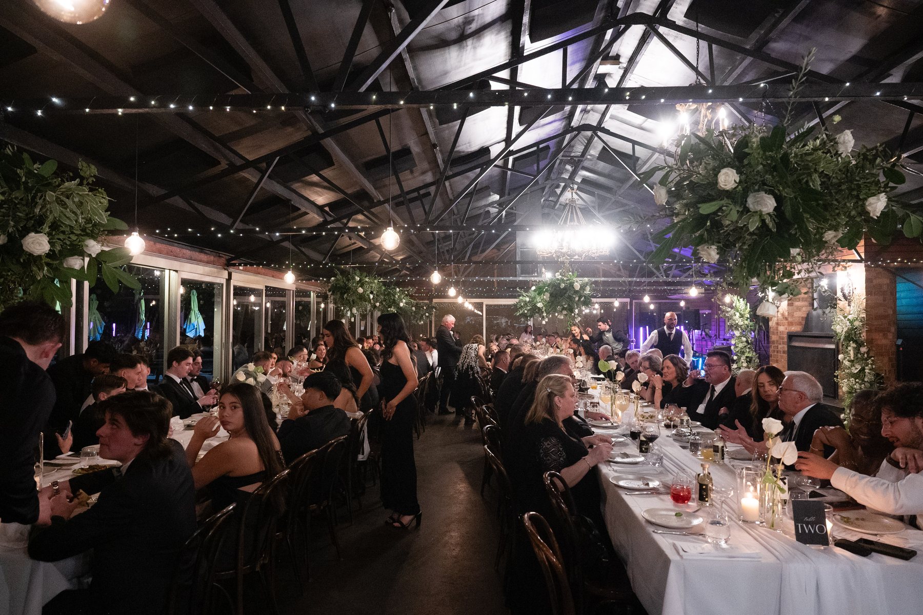 Zonzo Estate wedding — barn reception under festoon lights, Yarra Valley, by C2 Films