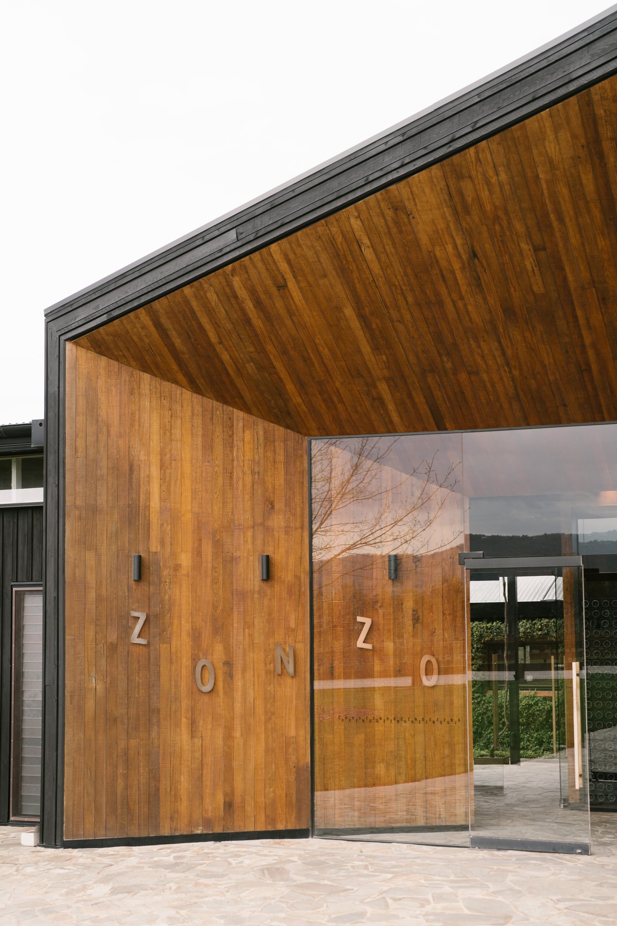 Zonzo Estate wedding — the timber entrance doors at Zonzo Estate, by C2 Films