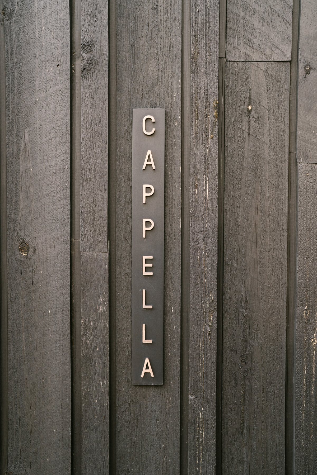 Zonzo Estate wedding — the Cappella chapel signage at Zonzo Estate, by C2 Films