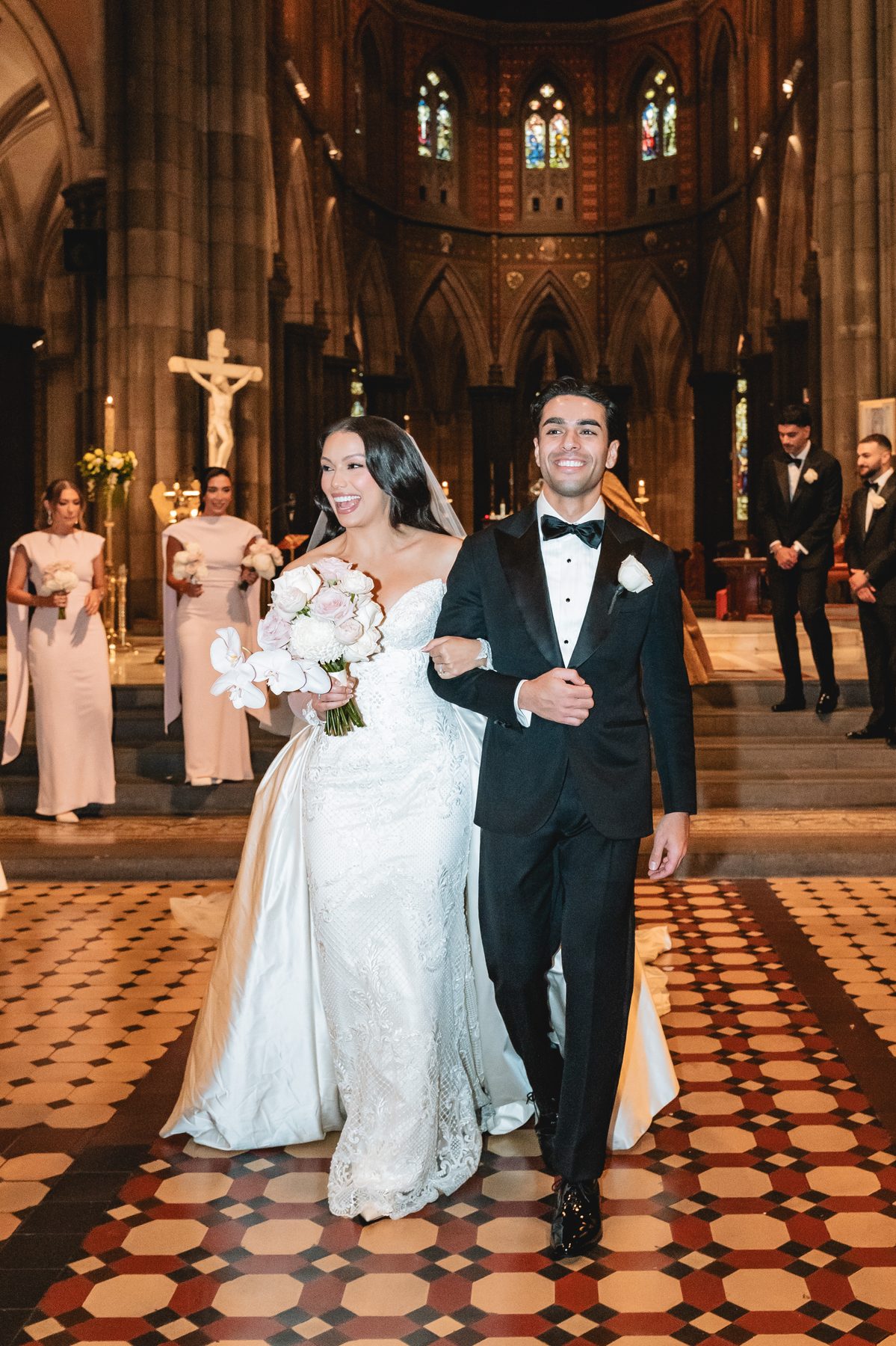 Jack and Natasha exchanging vows at St Patrick's Cathedral, Melbourne — C2 Films wedding photography