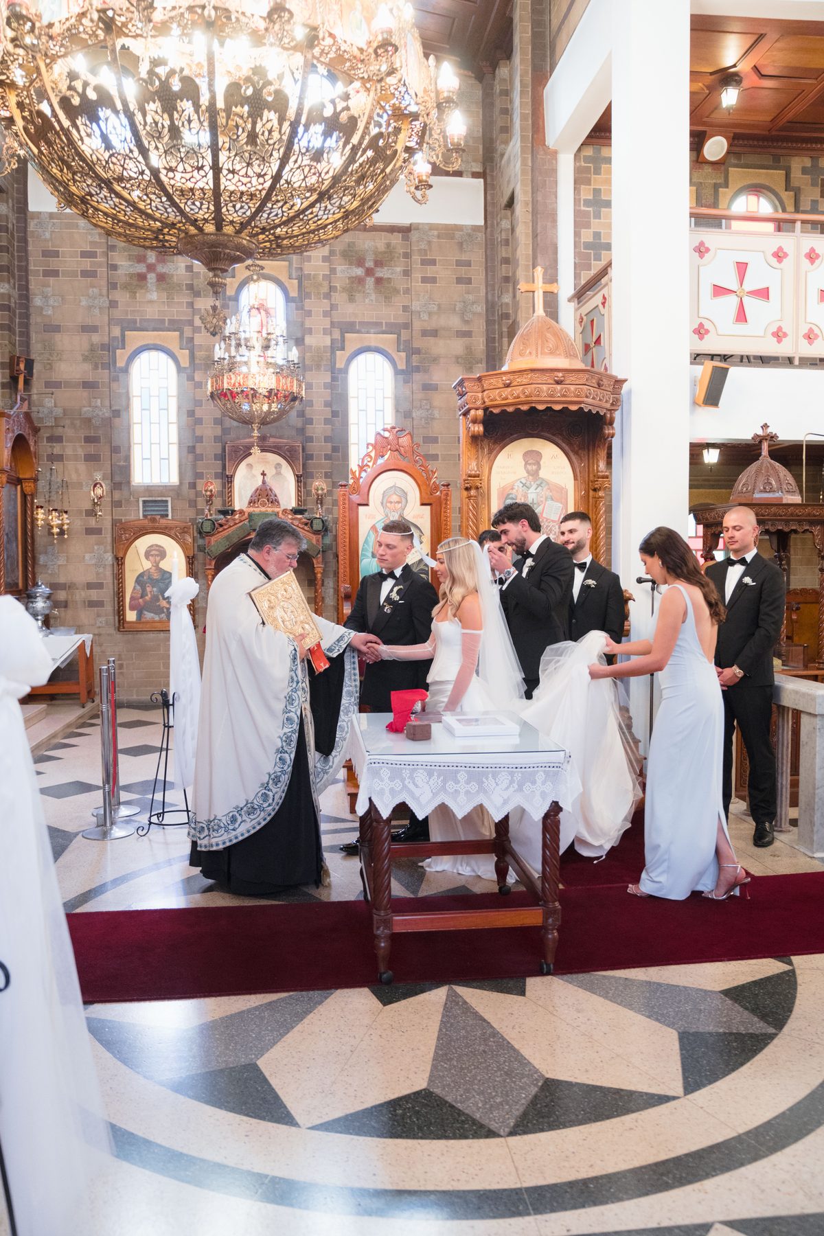 Jacob and Olivia walking down the aisle at St John the Forerunner Greek Orthodox Church, Carlton — C2 Films wedding photography
