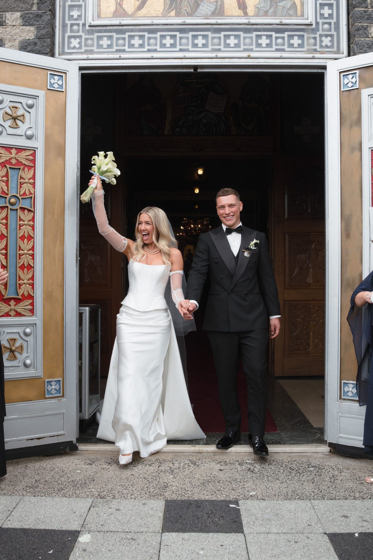 Jacob and Olivia during the ceremony at St John the Forerunner Greek Orthodox Church, Carlton — C2 Films wedding photography
