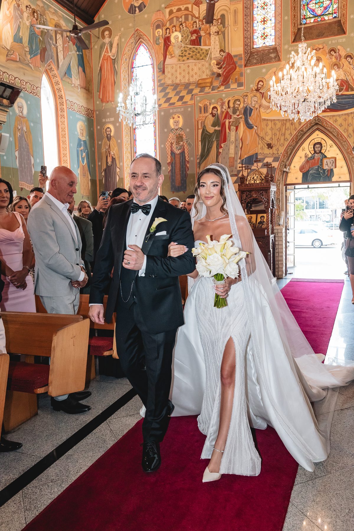 Jean-Claude and Elena after the ceremony at St Nicholas Greek Orthodox Church — C2 Films wedding photography