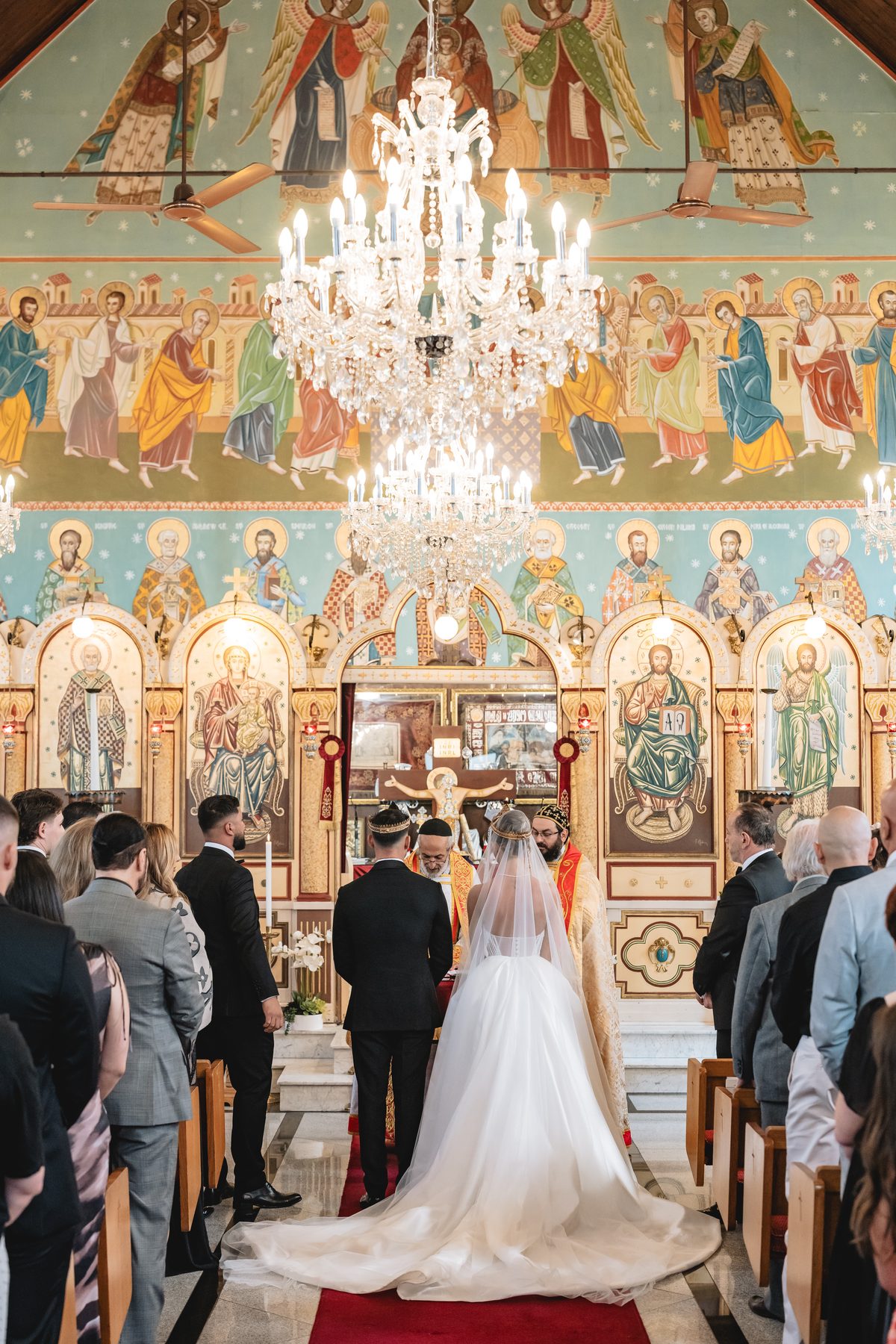 Jean-Claude and Elena during the ceremony at St Nicholas Greek Orthodox Church — C2 Films wedding photography