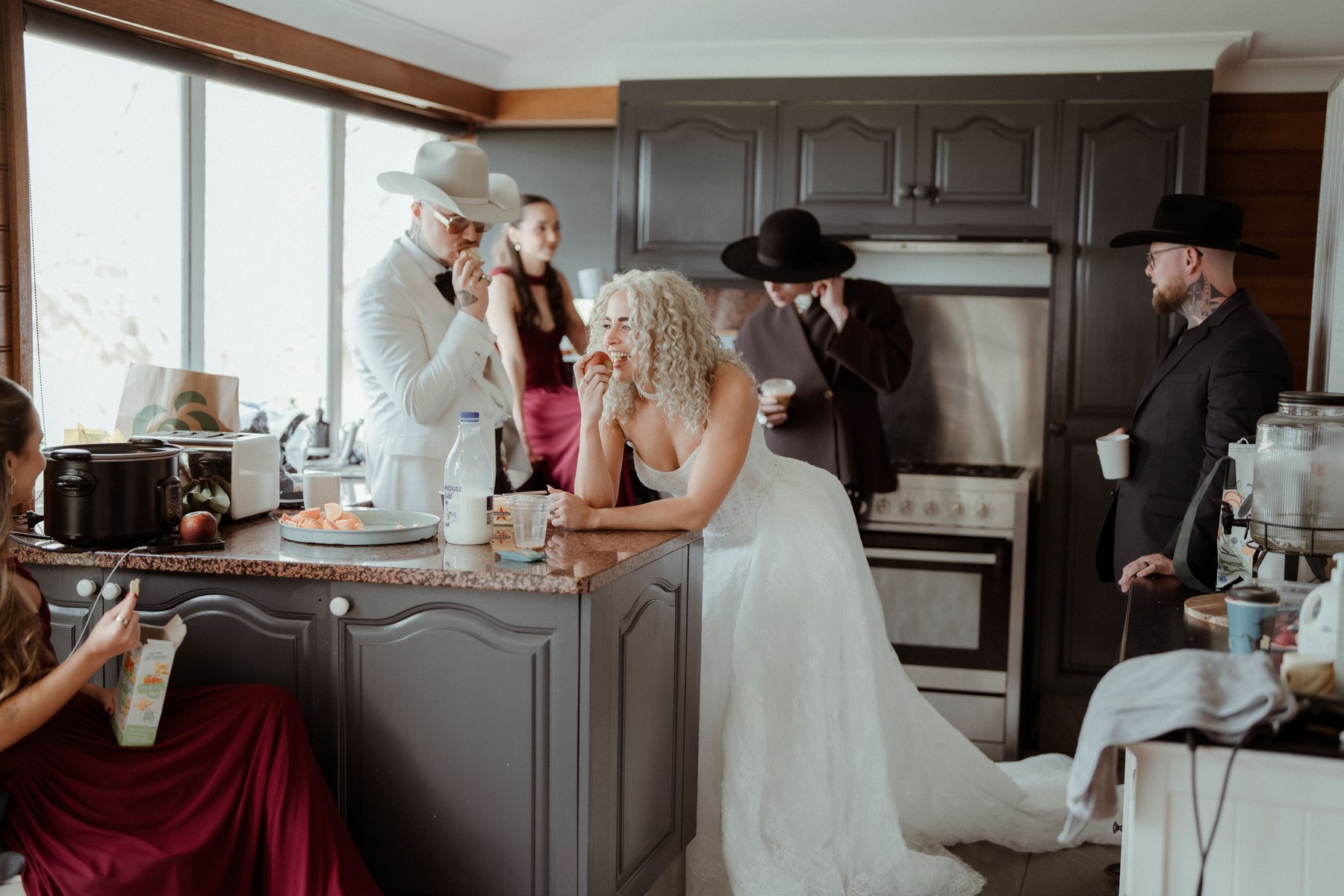 The bridal party in the kitchen during preparations at Rosewood Estate, Beechmont QLD — wedding photography by C2 Films
