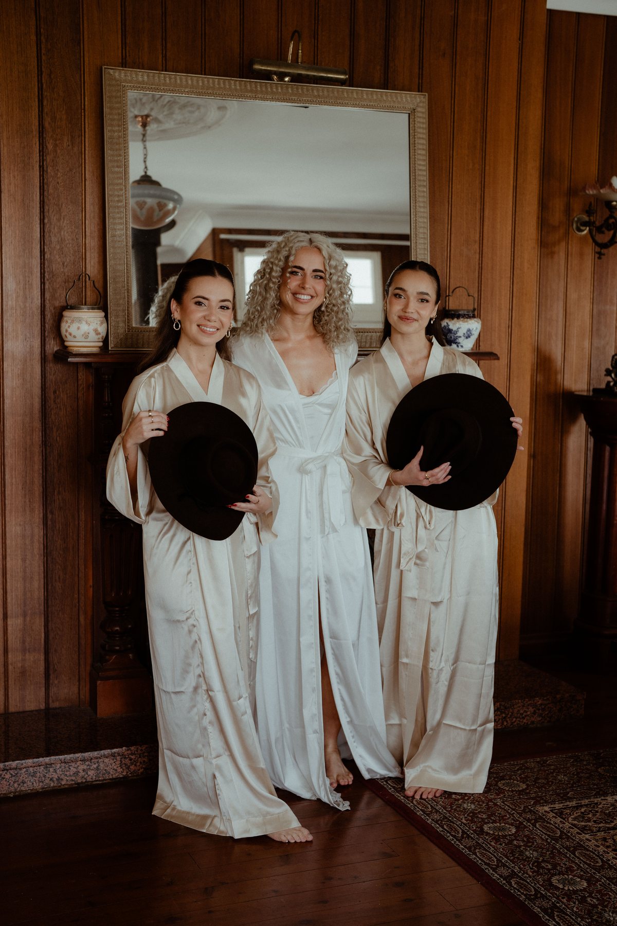 Monique and her bridesmaids in silk robes before the ceremony at Rosewood Estate, Beechmont QLD — wedding photography by C2 Films