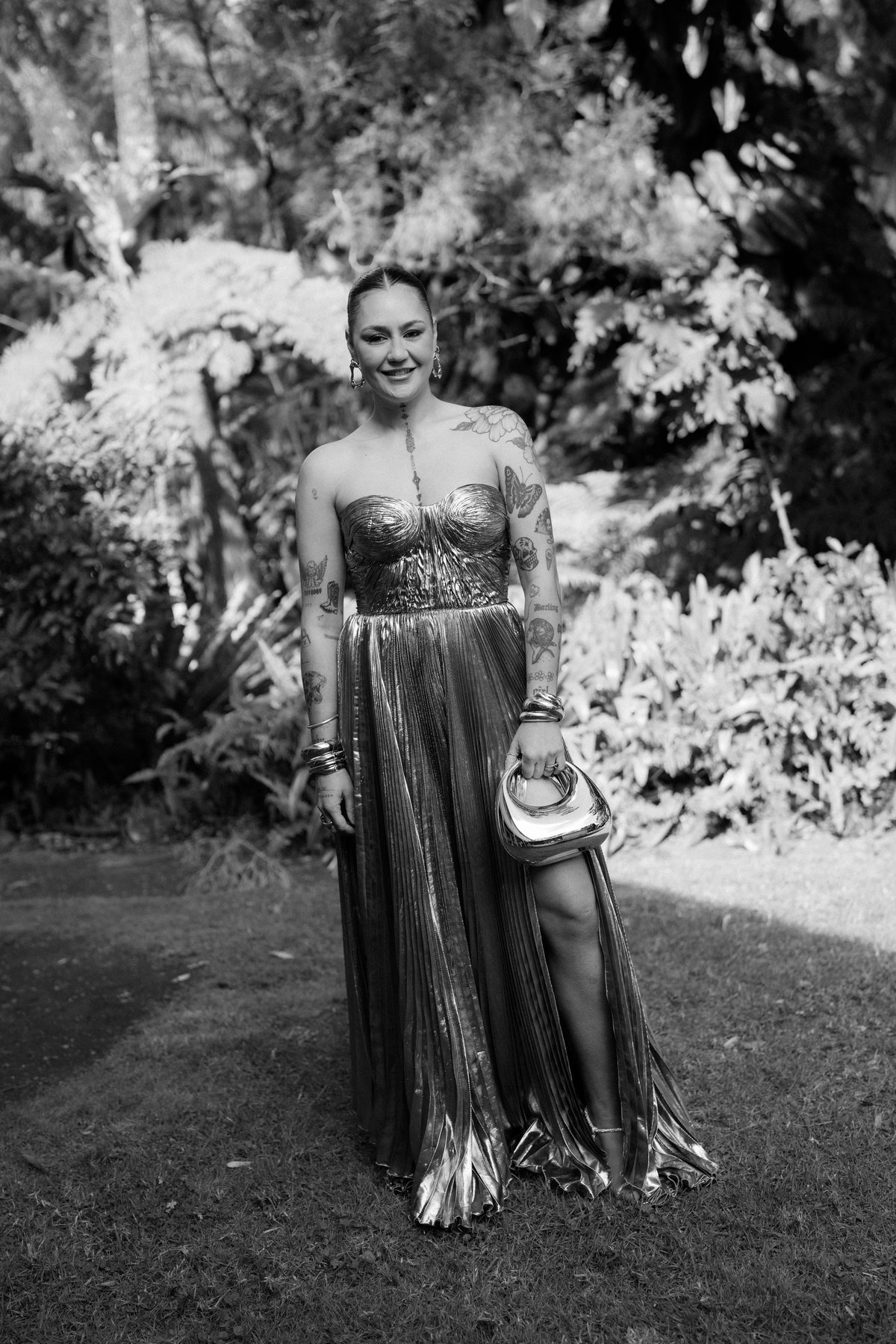 A guest photographed in black and white in the garden at Rosewood Estate, Beechmont QLD — wedding photography by C2 Films