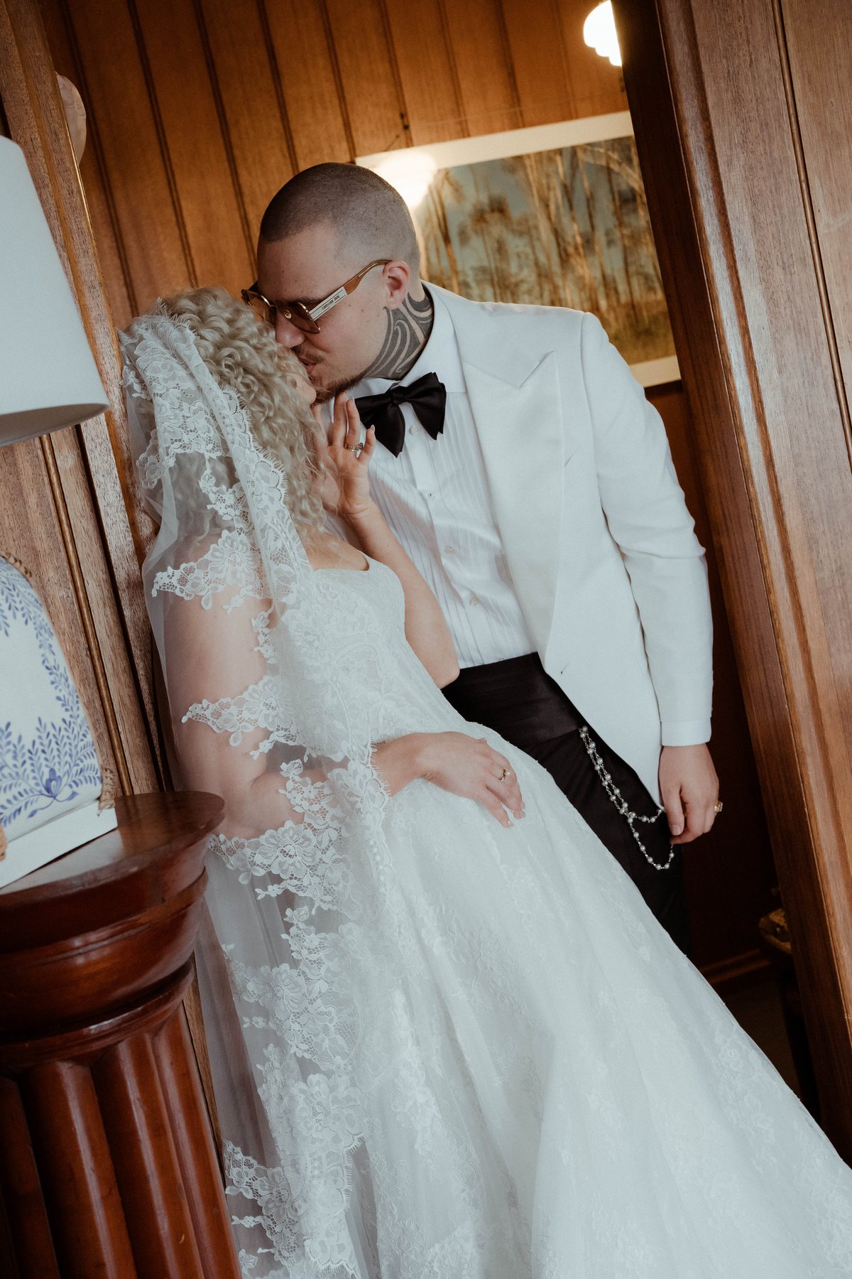 Kaleb taking Monique's hand indoors before the ceremony at Rosewood Estate, Beechmont QLD — wedding photography by C2 Films