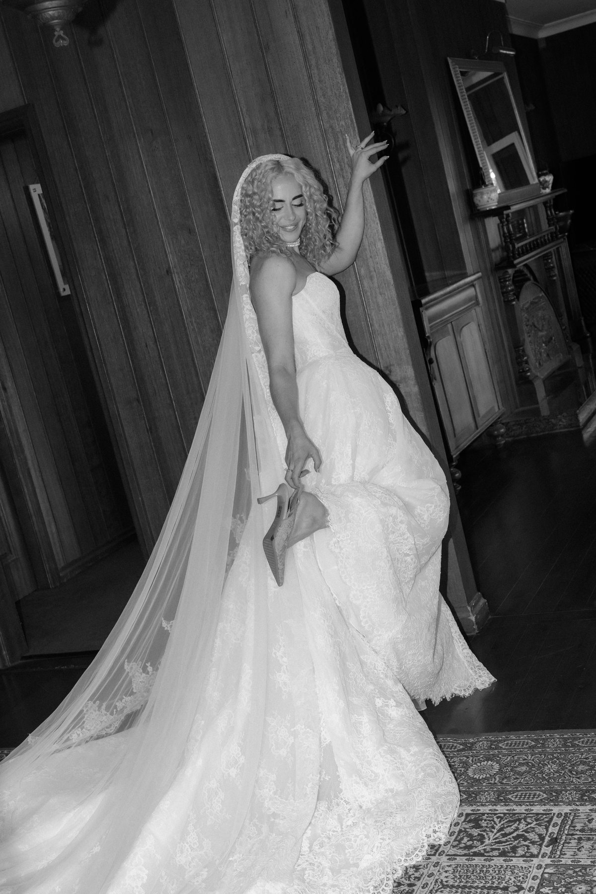 Monique in her cathedral veil, train sweeping the floor at Rosewood Estate, Beechmont QLD — wedding photography by C2 Films