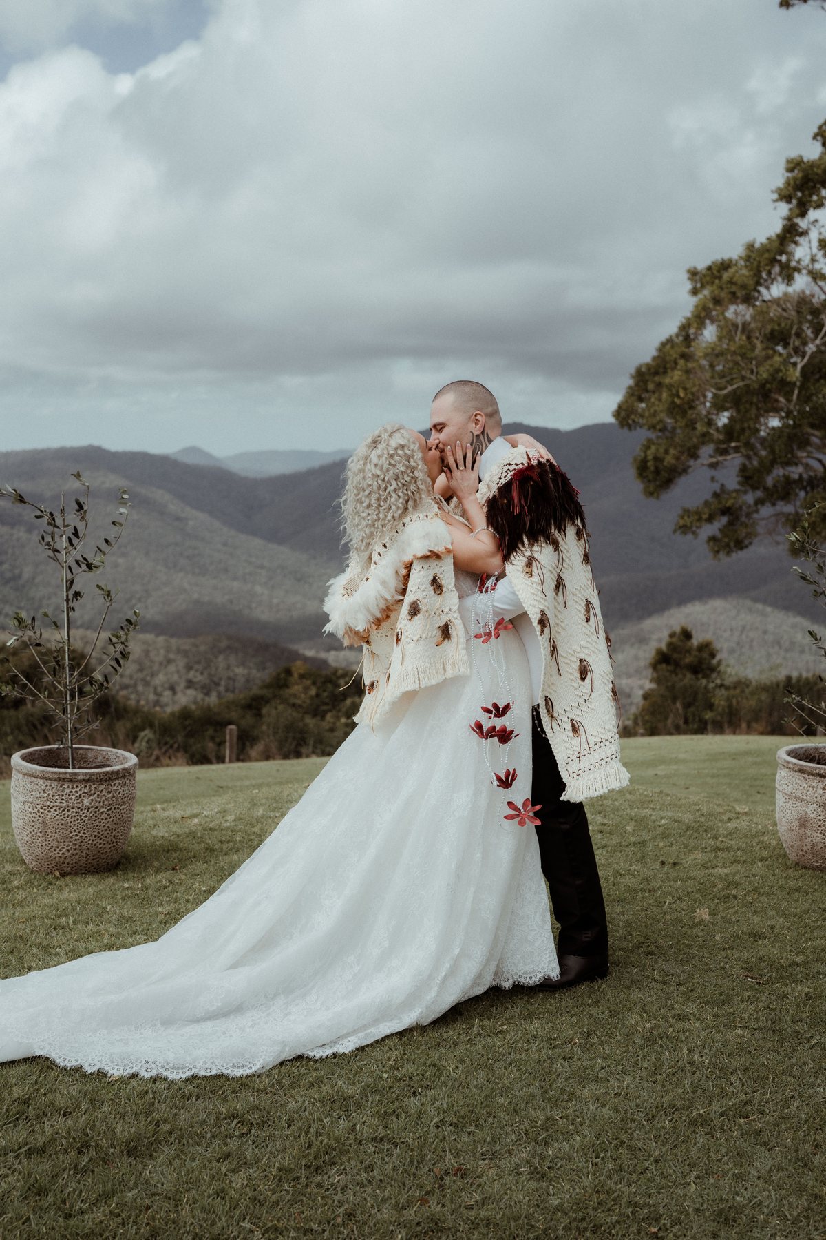 Kaleb and Monique embracing at the end of the ceremony at Rosewood Estate, Beechmont QLD — wedding photography by C2 Films