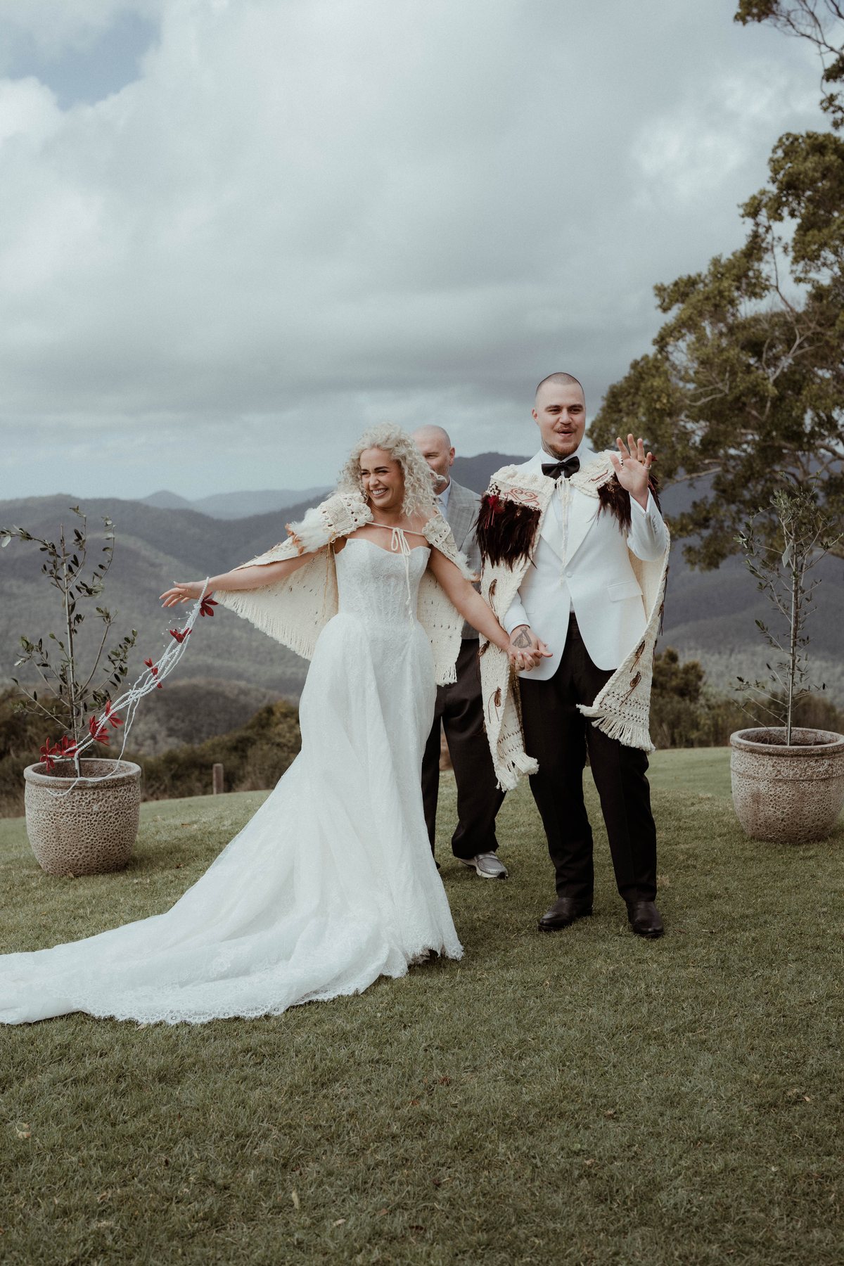 Kaleb and Monique celebrating after the ceremony at Rosewood Estate, Beechmont QLD — wedding photography by C2 Films