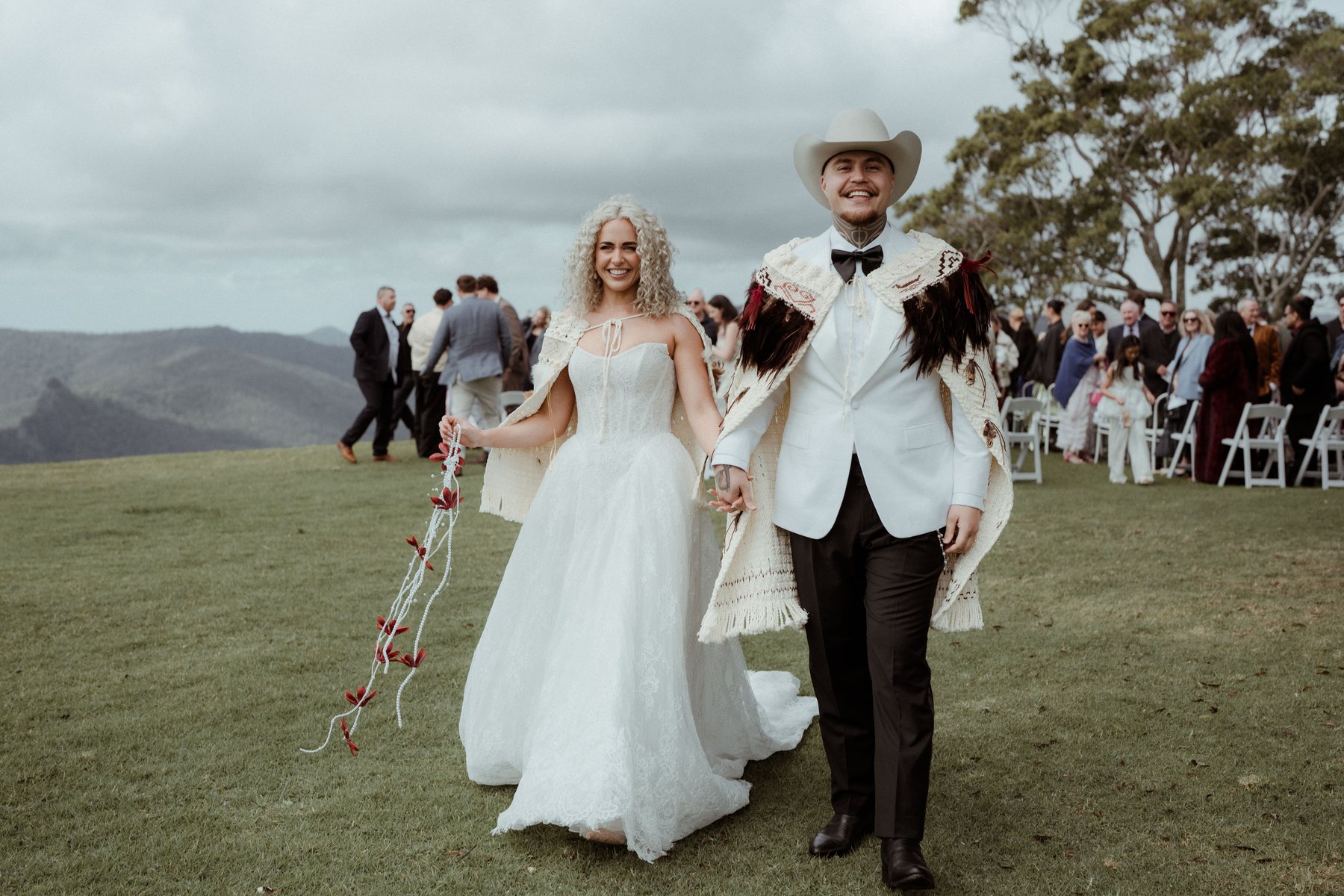 Walking back through the guests after the ceremony at Rosewood Estate, Beechmont QLD — wedding photography by C2 Films