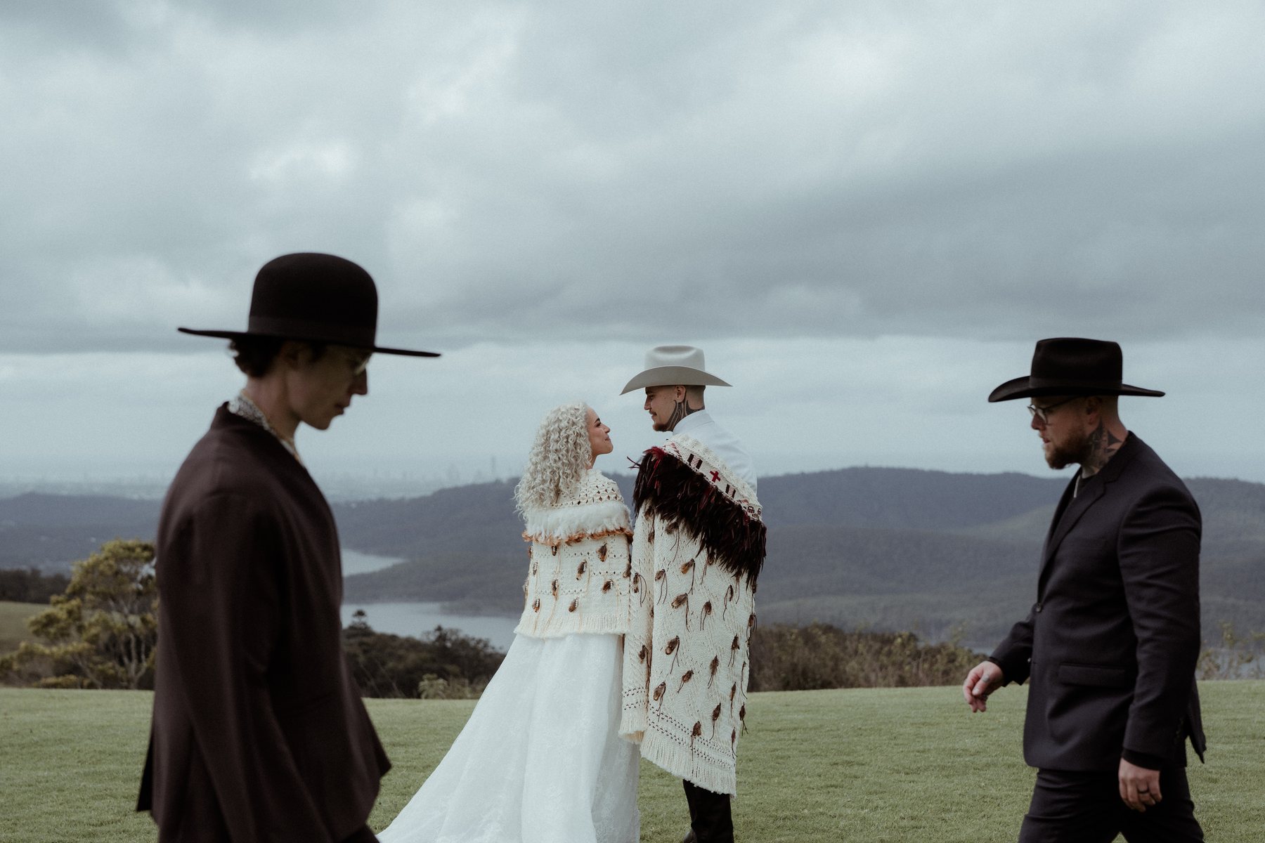 Kaleb and Monique with friends on the open grass at Rosewood Estate, Beechmont QLD — wedding photography by C2 Films