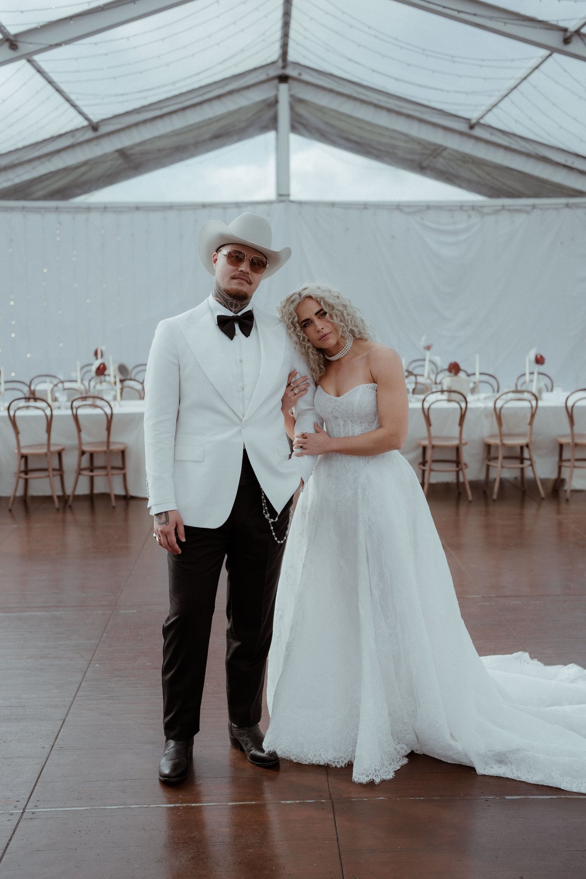 Kaleb and Monique in the marquee at the reception at Rosewood Estate, Beechmont QLD — wedding photography by C2 Films