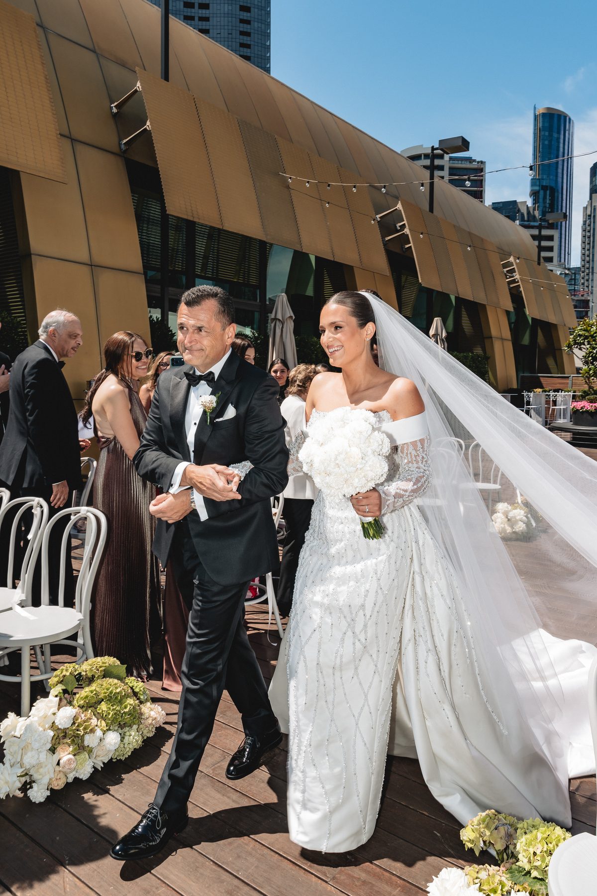 Mo and Elyse walking down the aisle at Crown Aviary, Southbank — C2 Films wedding photography