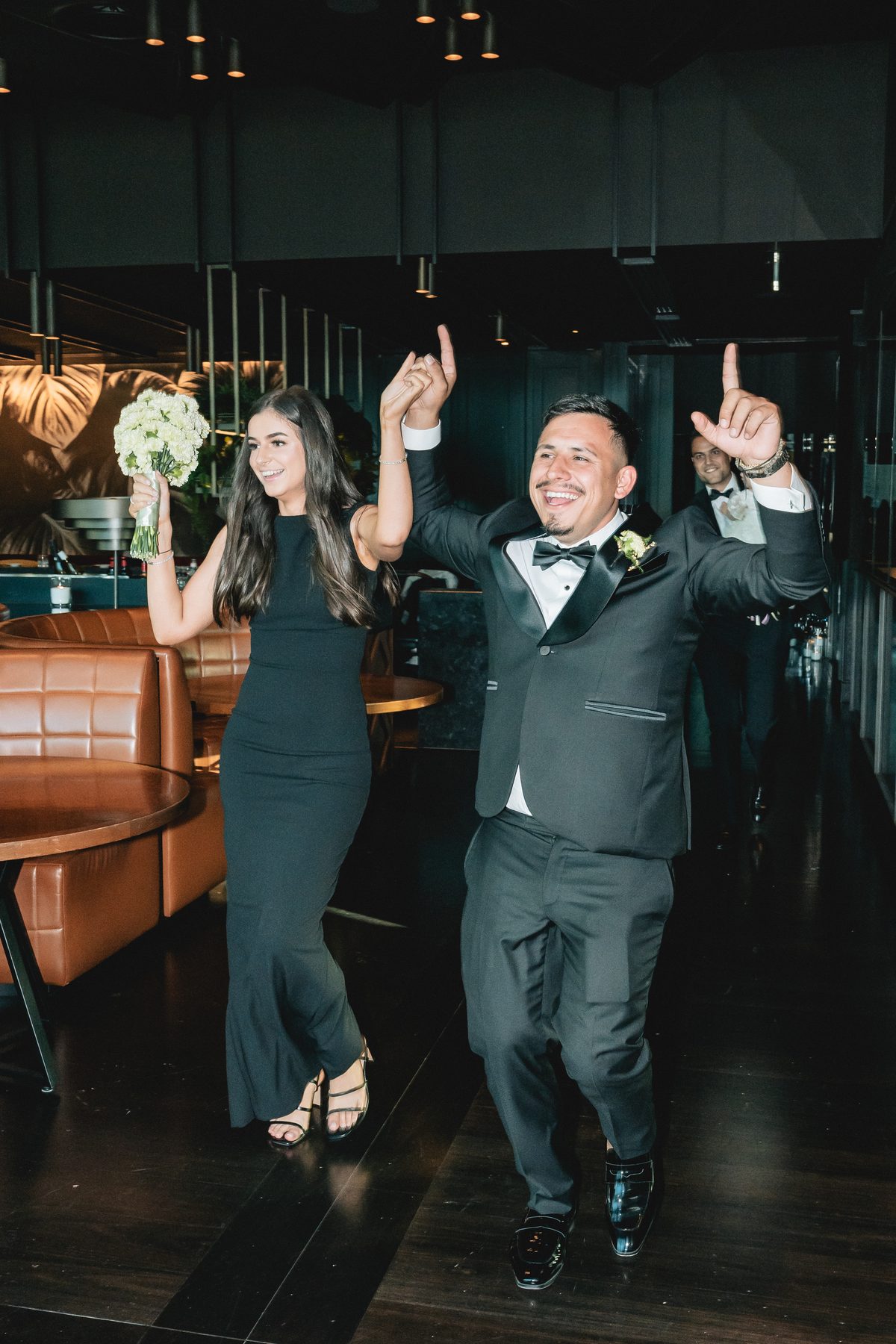 Mo and Elyse — celebrating at the reception at Crown Evergreen, Southbank, Melbourne wedding photography by C2 Films