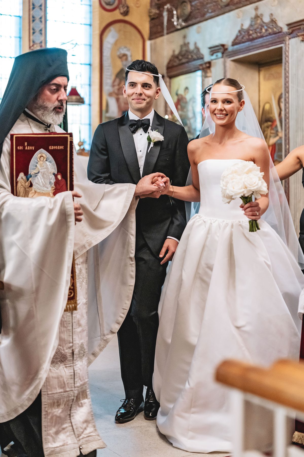 Simon and Sara walking down the aisle at St Eustathios Greek Orthodox Church — C2 Films wedding photography