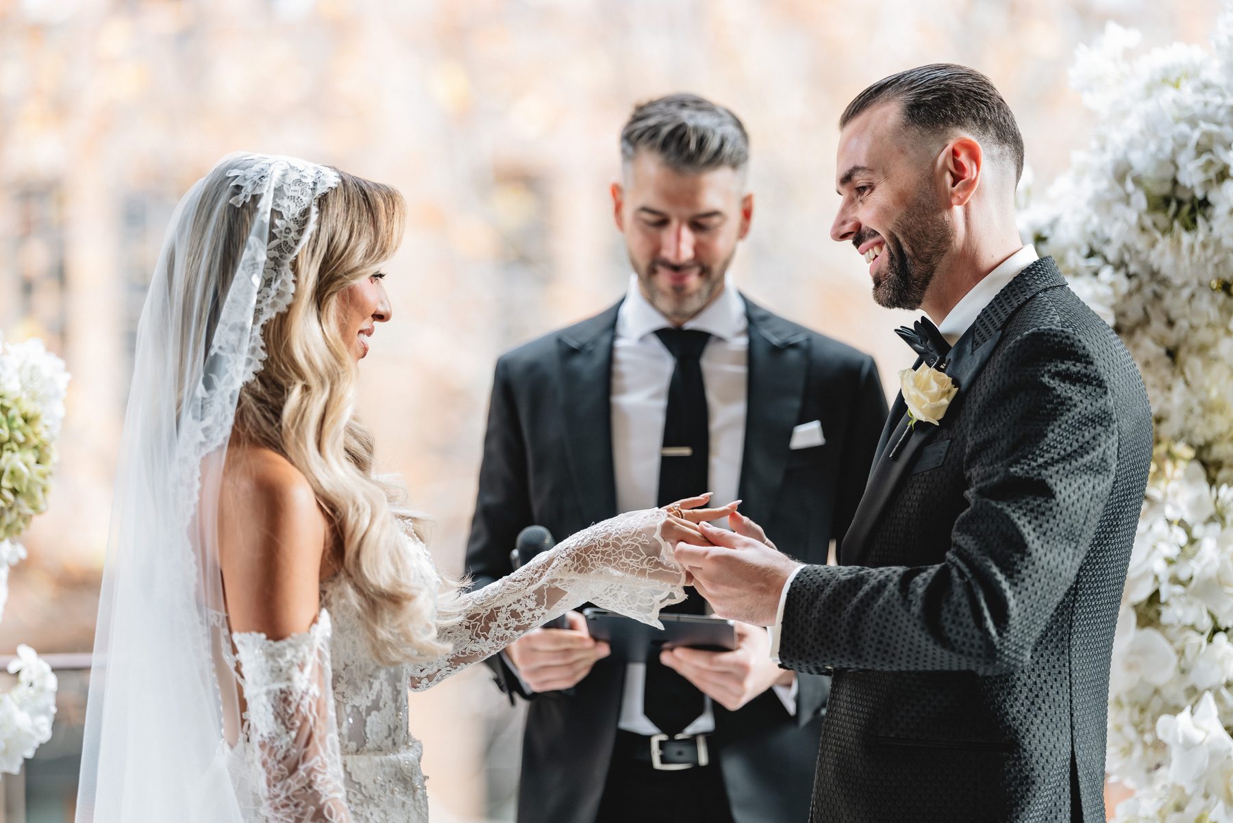 Toni and Suzie walking down the aisle at Melbourne Town Hall — C2 Films wedding photography